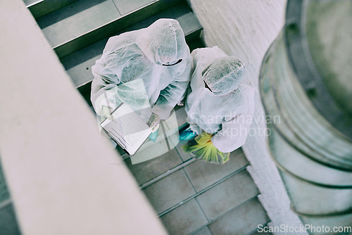 Image of Medical team and covid hygiene healthcare professionals wearing hazmat suits for safety while working at quarantine site. Above first responders in protective gear to fight virus with innovation