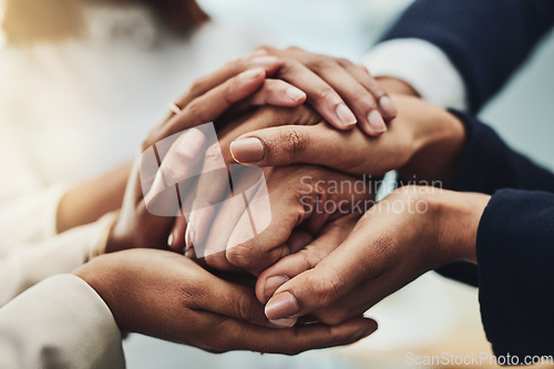 Image of Business people holding hands for support, motivation and comfort together at work. Closeup of group of professional employees, colleagues and workers joining hands for help, consoling and community