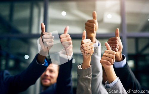 Image of Thumbs up with hands of a business team or group giving their approval, saying thank you or giving motivation together in their office at work. Corporate professionals supporting with trust