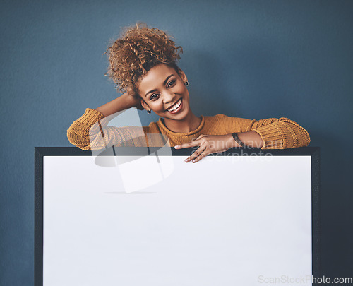 Image of Woman showing blank poster, copy space board and placard sign to promote, market and advertise opinion or voice on voting democracy. Portrait of smiling, young and happy lady endorsing with billboard