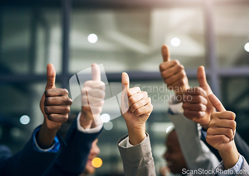 Image of Hands showing thumbs up with business men endorsing, giving approval or saying thank you as a team in the office. Closeup of corporate professionals hand gesturing in the positive or affirmative