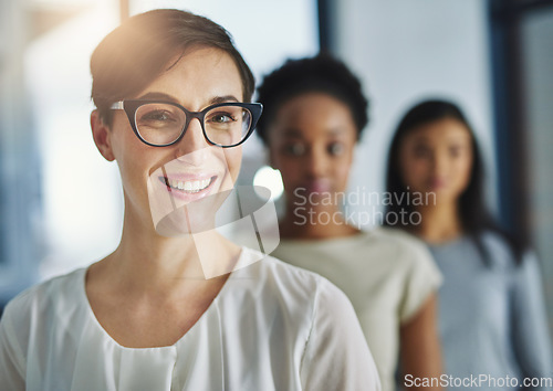 Image of Smiling and happy modern business woman looking proud of her success and team. Portrait of a female office worker with a smile enjoying her job. Successful colleague ready for a work collaboration