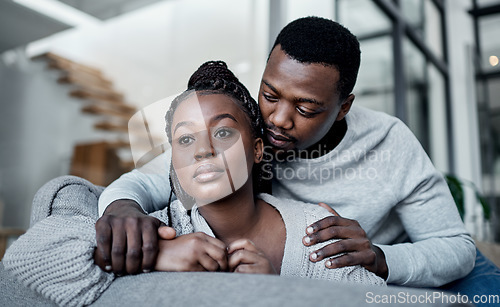 Image of Unhappy, sad and depressed couple while boyfriend comfort, support and hug partner while struggling, mourning loss or depression problem at home. Asking forgiveness after argument about cheating