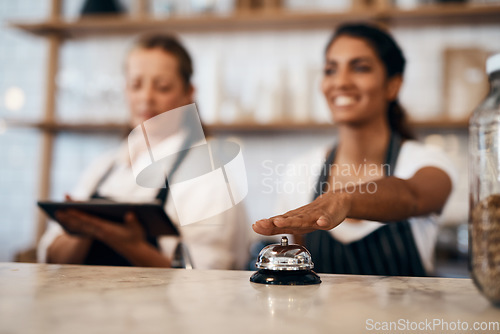 Image of Waitress hands ringing service bell for a ready order in cafe, restaurant and coffee shop. Waitresses, servers and baristas serving, assisting or alerting waiter staff of prepared orders for people