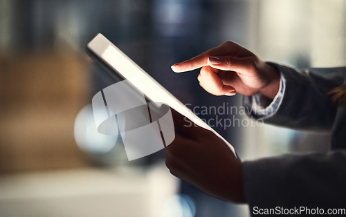 Image of Closeup of woman reading social media news on a digital tablet while working late in an office. Professional female browsing online, researching creative plans and strategies for a business project