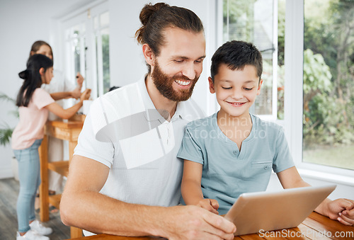 Image of Learning with tablet, watching educational videos and searching the internet with father and son relaxing together at home. Smiling, curious and happy boy browsing the web and having fun with parent