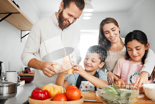 Image of Healthy dinner, cooking and bonding of a family making and preparing food together in a kitchen. Smiling parents teaching happy young kids how to make a health meal with organic vegetables at home