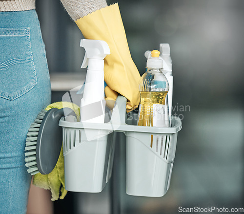 Image of Domestic worker, maid or cleaner hands holding or carrying cleaning products and equipment or supplies. For home hygiene, contact us for a handy helper agency or professional household service.