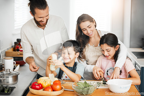 Image of Healthy food, cooking and bonding of family making, preparing and cutting ingredients for meal together in a home kitchen. Happy parents teaching fun kids about fresh, homemade and nutritious eating