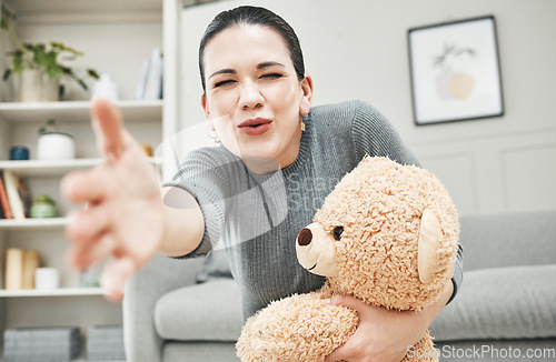 Image of Social worker, therapist or psychologist with teddybear for support, child wellness and development in therapy or children center. Elderly lady or Grandmother with loving and fun gift or toy for kid.