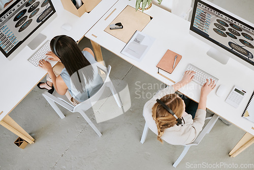 Image of Marketing agents, sales consultants and operators from above working on computers while networking, talking and consulting. Businesspeople selling, helping and promoting online in call center office