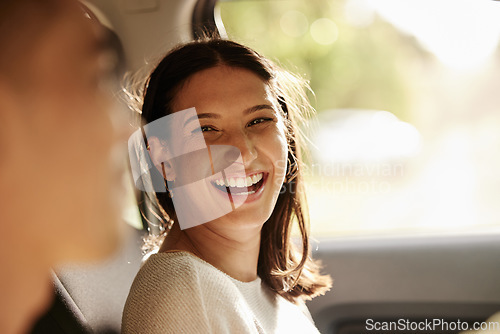 Image of Happy, cheerful and laughing woman enjoying a road trip, holiday or vacation with her boyfriend in the car. Latino woman having fun in a vehicle while on a journey to a romantic destination