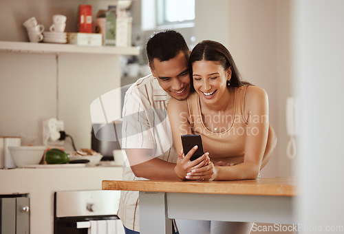 Image of Happy, in love couple with a phone looking at funny content on social media, watching video or staying connected online. Bonding, romantic man and woman in relationship enjoying time together at home