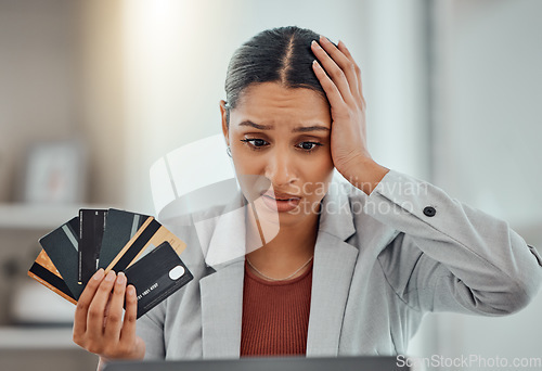 Image of Finance, debt and credit with a business woman suffering from worry, stress and anxiety of inflation in the economy. Young female holding bank cards and having problems while trying to pay an account