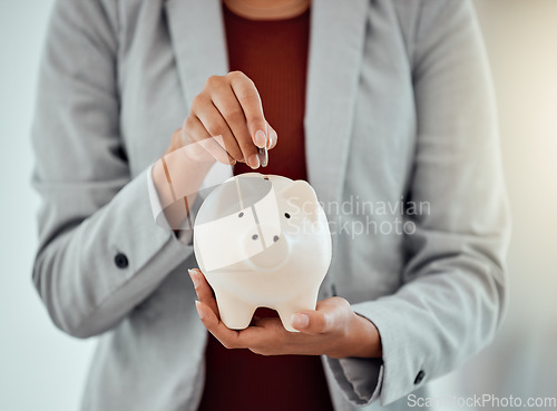 Image of Banking, finance and money in piggybank for savings, investment and growth for business woman. Closeup of hands of a corporate professional putting coins into a tool to save, insurance and security