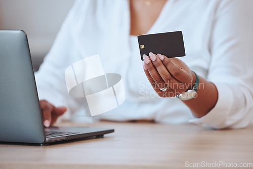Image of Credit card, laptop and finance with a businesswoman paying her bills and mortgage online. Black woman ordering, hands and banking as she saves money in her bank account for a budget or loan.