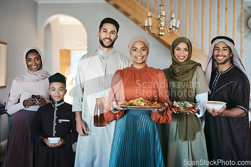 Image of Portrait of a happy, smiling and positive muslim family celebrating Ramadan together, spending the day embracing religious holiday. Islamic siblings gathering for lunch in their family house