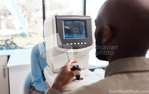 Image of Eye exam by a doctor looking and checking the vision of a patient at a sight specialist office. Medical healthcare screen technology helping an optometrist see retina health and wellness