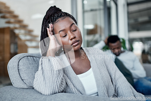 Image of Sad, frustrated and tired woman ignoring husband during a fight, argument and conflict about divorce, breakup and relationship problems. Unhappy, stressed and depressed wife feeling sad in a marriage