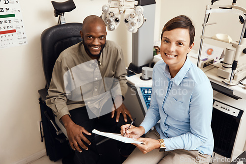 Image of Optometrist, doctor and vision specialist doing eye test on patient in a clinic. Portrait of happy, smiling and friendly practitioner writing notes while giving good service for optical prescription