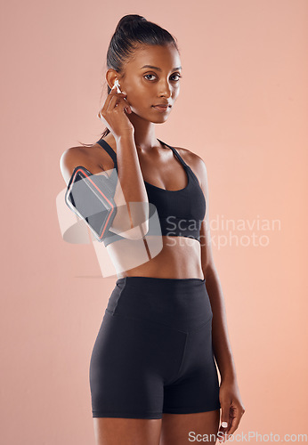 Image of A listening to music, fit and healthy slim woman living a active, wellness and body or weight watching lifestyle. Fitness, training and sports lover ready for workout routine with athletic sportswear