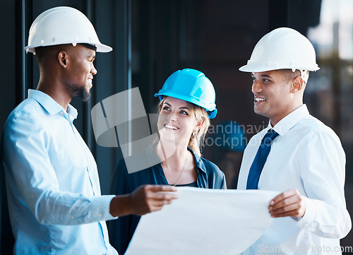 Image of Architect, engineer and building contractor looking at plans or blueprints while talking and discussing strategy. Team or group of builders looking motivated and ready to develop, renovate or remodel