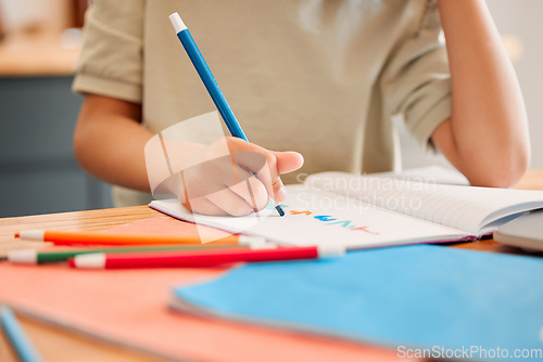 Image of Student drawing picture in book, learning math and doing calculations in a notebook for education in a classroom at school. Little child writing, being creative with numbers and studying in class