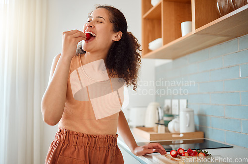 Image of Eating, chopping or making fruit salad with strawberries, bananas or healthy ingredients in home kitchen. Smiling or happy woman cooking, biting and tasting fresh snack food or preparing breakfast