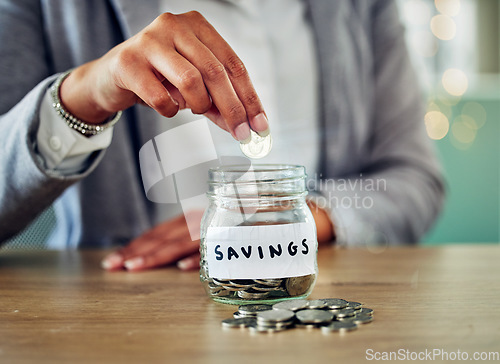 Image of . Savings jar, money coins and change of a woman hand holding and saving cash to budget. A female planning investment, retirement and financial security. Closeup of financial growth for the future.