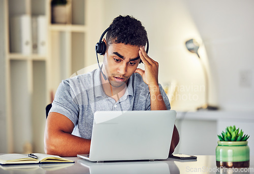 Image of . Bored, tired and working customer service web support worker on an online computer call. Internet helpdesk male employee with a headset and headache feeling overworked from digital consulting job.