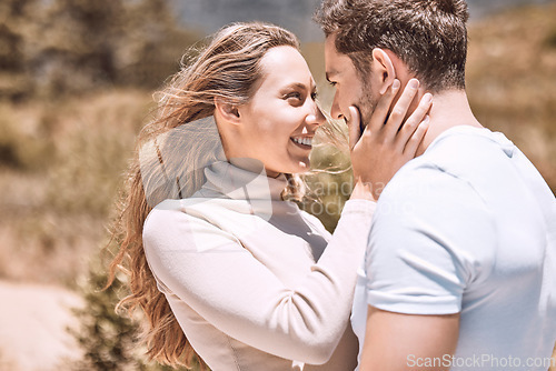 Image of Love, romance and dating with an affectionate young couple standing face to face and sharing an intimate moment while outside on a date. Man and woman loving, spending time together and bonding