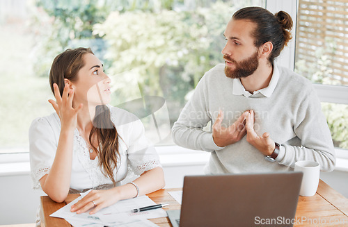 Image of Stress, finance and arguing couple talking about budget, home loan and bills while sitting with tax papers and laptop . Man and woman with problem upset about bad financial debt and mortgage payment