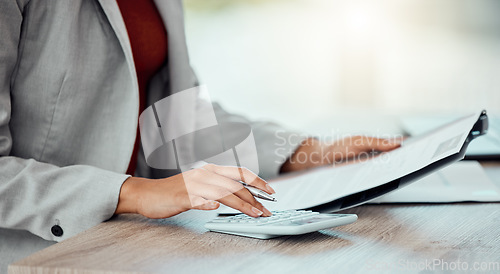 Image of Closeup of auditor, banker and business accountant womans hand calculating, planning and doing financial paperwork. A businesswoman managing investment, medical healthcare and insurance payments