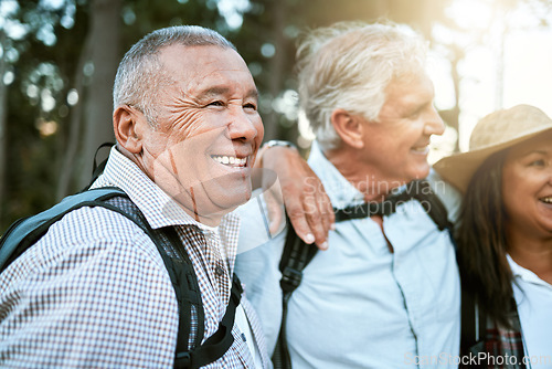 Image of . Hiking, adventure and exploring with a carefree and excited male hiker with his senior friends outdoors. Enjoying a hike or walk in the forest or woods as a group of retired people for leisure.