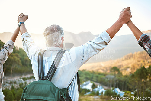 Image of . Happy senior man hiking with friends, a celebration of the mountain view after holiday adventure trail in nature. Exercise to stay active, fit and healthy for lifestyle of wellness into retirement.