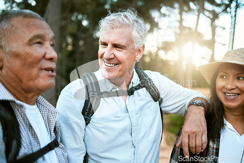Image of Hiking, adventure and exploring with a group of senior friends and retired adults enjoying a hike or walk outdoors in nature. Enjoying the view while on a journey of discovery in the forest or woods