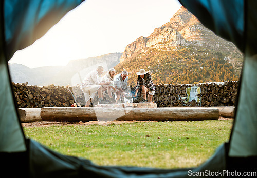 Image of People camping with a tent and roast marshmallows on a campfire enjoy outdoors, nature and the wild. Fresh air, adventure and travel lifestyle campers on a campsite relax and bond on wellness retreat