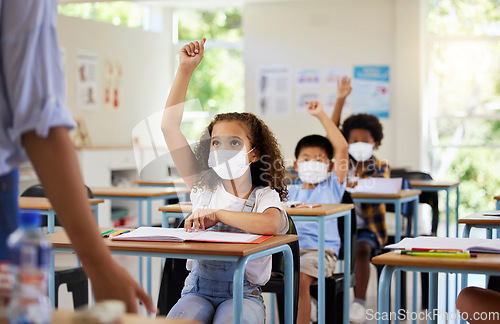 Image of Covid, education and learning of eager, smart and clever children raising hands and wearing masks in a classroom. Teacher or educator asking questions for knowledge test at kids school in a pandemic.