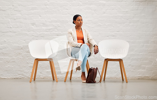 Image of Employment, hiring and recruitment with young woman sitting on a chair waiting for her interview with HR in a creative office. Female shortlist candidate ready for her meeting or appointment