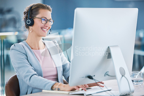Image of Call center, customer service and agent with computer talking to customers, helping and answering office calls. Mature, happy and friendly helpdesk operator, secretary and contact us client support