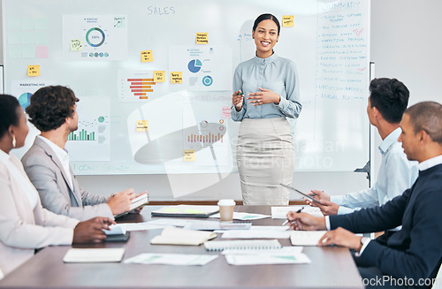 Image of Presentation, workshop and training seminar with a young business woman talking to her team of colleagues during a boardroom meeting. Learning, teaching and coaching during an upskilling session