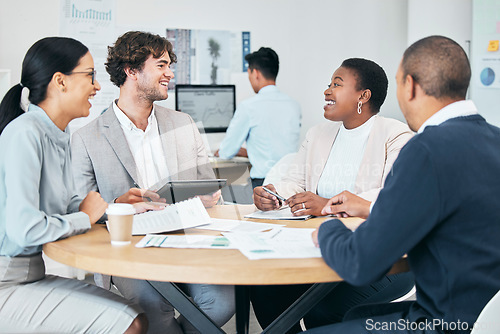 Image of Diverse business marketing team enjoying casual chat during meeting in modern office, smiling and laughing. Happy colleagues planning and sharing idea or goal while discussing a strategy for startup