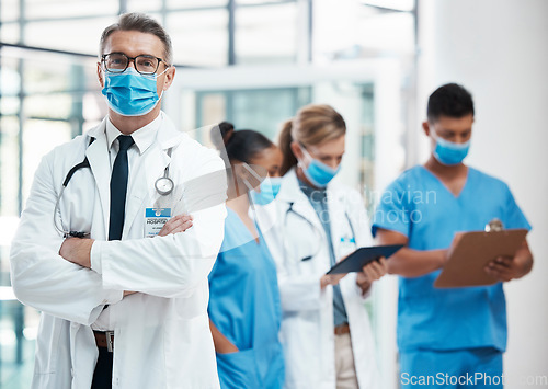Image of Medical doctors, nursing and healthcare nurses standing with covid masks for their safety in a hospital. Successful, professional and trustworthy medic expert with a stethoscope in an emergency room
