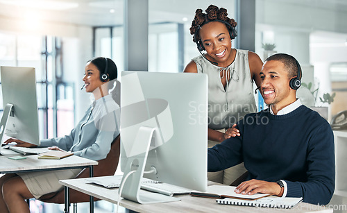 Image of Manager training call center agent on computer with talking, discussing and negotiating deals, sales and promotions for customer. Office colleagues leader helping learning intern with client on tech