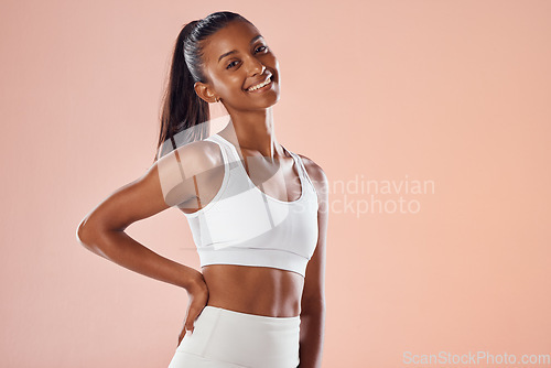 Image of Fit, athletic and stylish female athlete in sportswear smiling and feeling happy, ready and excited for a workout. Portrait of a cute African American athlete with an active style