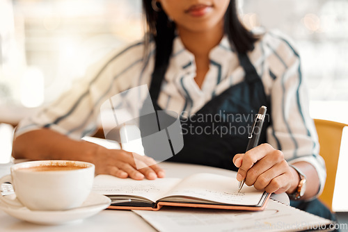 Image of Writing, coffee shop owner and cafe entrepreneur with vision ideas, planning innovation and preparing schedule or menu. Closeup hands of restaurant barista using notebook or book to calculate finance