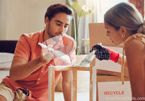 Image of Couple painting or decorate wooden table or chair by recycle and thrift furniture for a home improvement project in apartment. Creative and DIY man and woman with reusable objects in their house