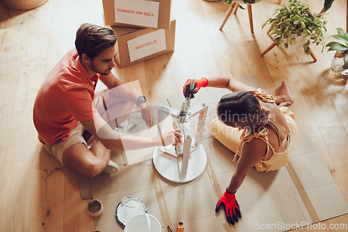 Image of Recycle, thrift furniture and painter couple painting wooden table for new creative project in an apartment. Above view of man and woman working on DIY home improvement with a reusable craft object