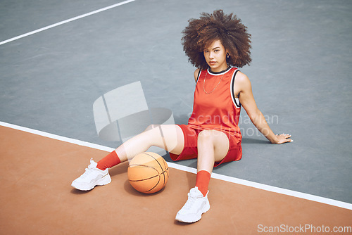 Image of Basketball player on court, getting ready for game and workout before fitness exercise outside. Portrait of a black woman sports person with afro playing, training and exercising in sport fashion