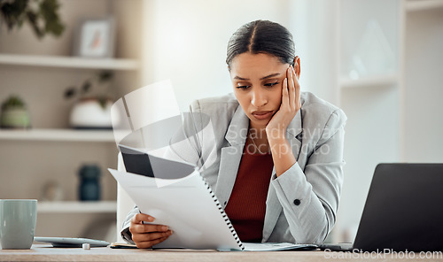 Image of Bored, thinking professional businesswoman reading and managing company financial crisis strategy report. Stressed employee working on investment loss of economy market shares of company